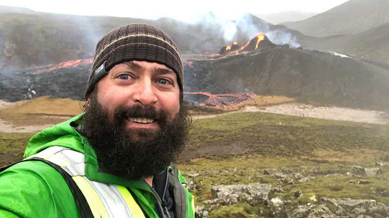 Associate professor Christopher Hamilton with volcano