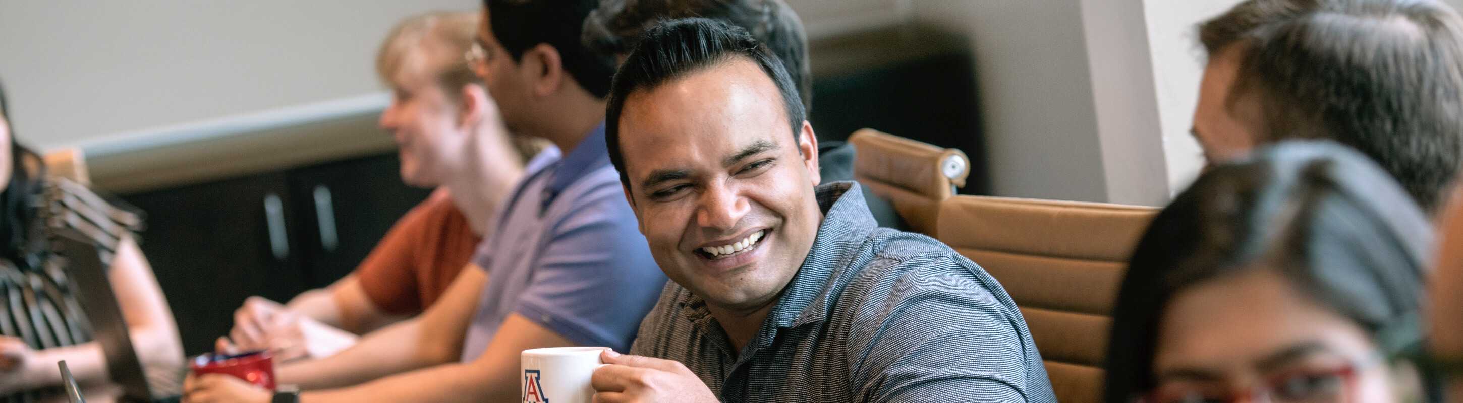 student smiling in small class setting