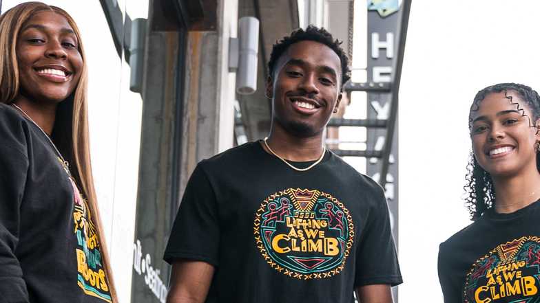 University of Arizona students modeling shirts celebrating Black History Month