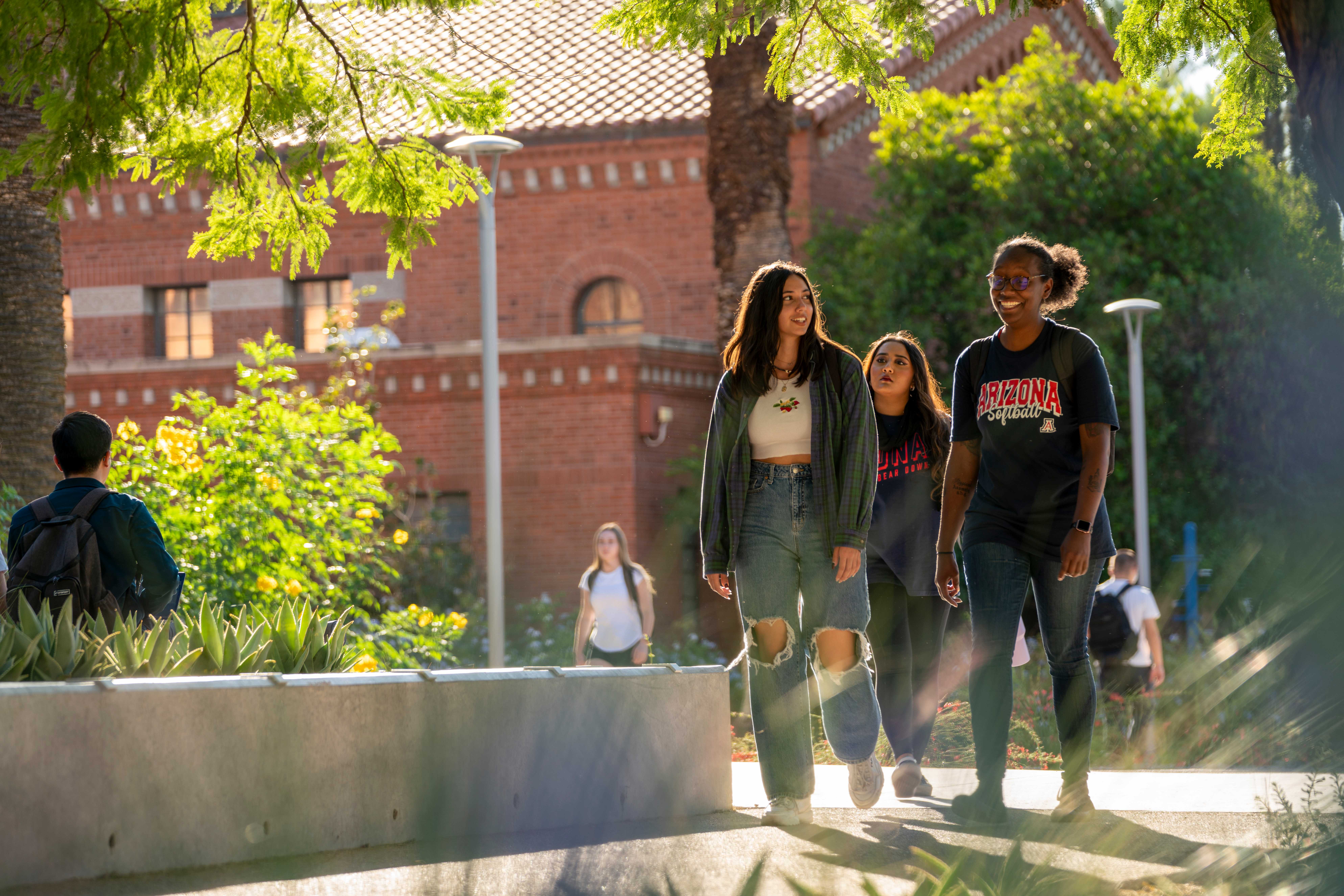 Students talking and walking on campus