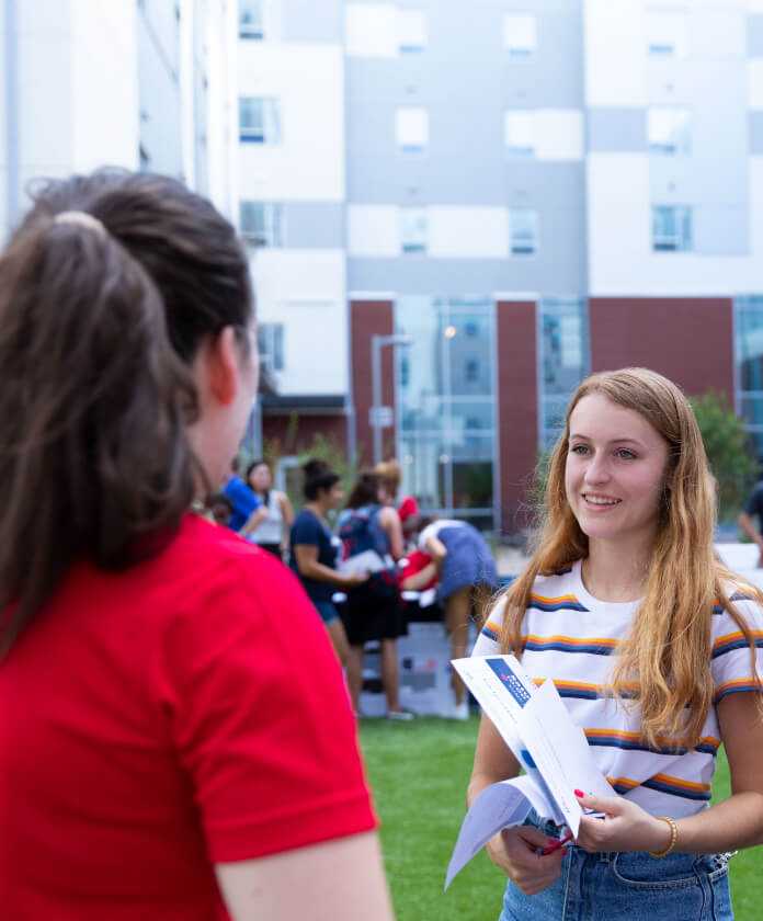 Student talking outside