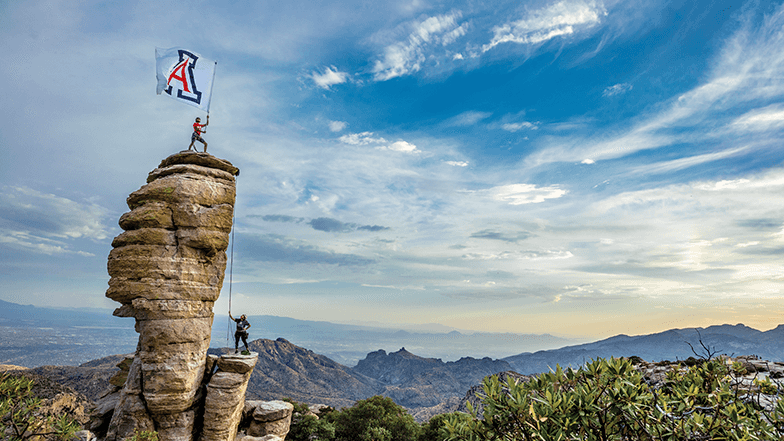 Students raising Arizona flag