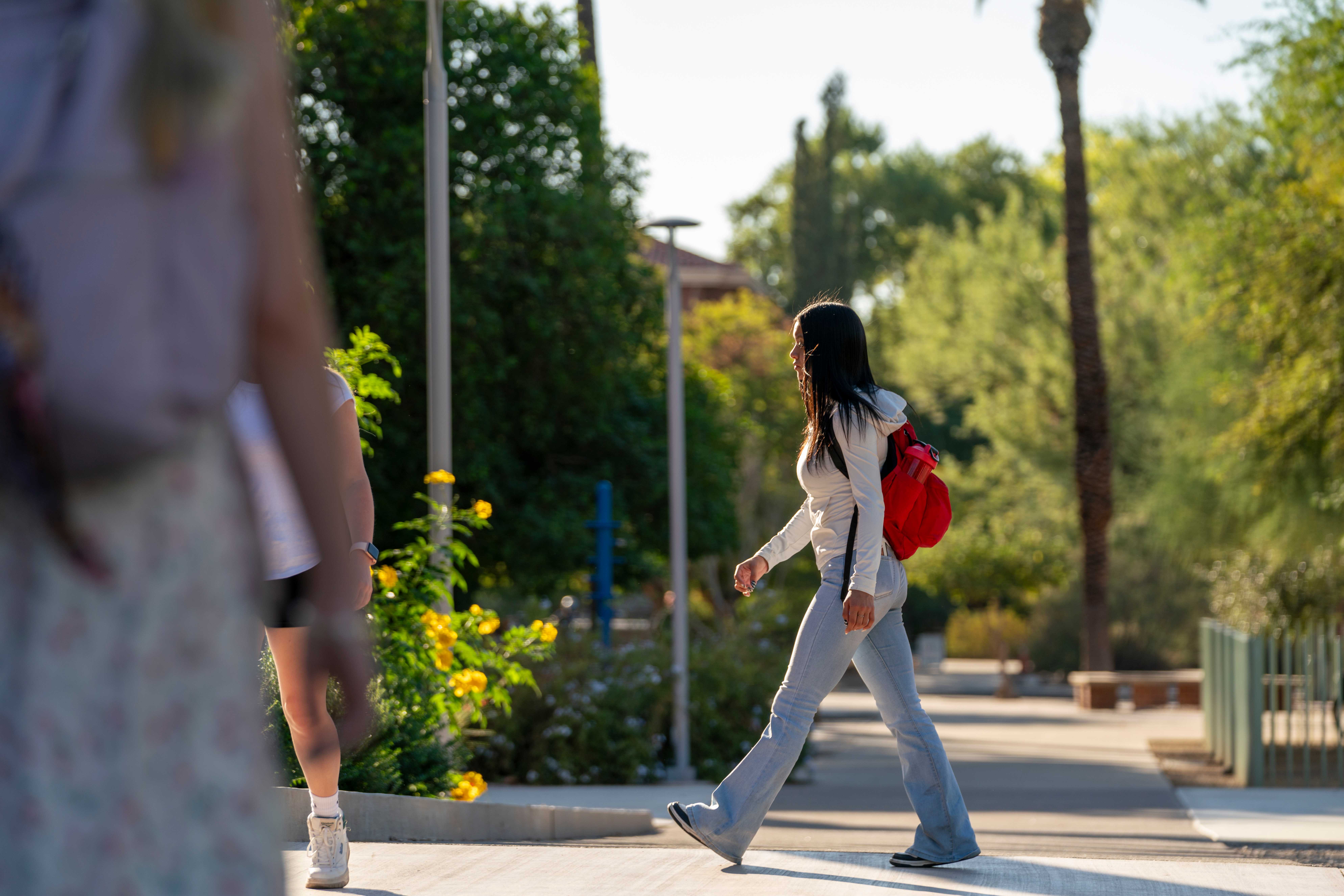 Student walking across campus.