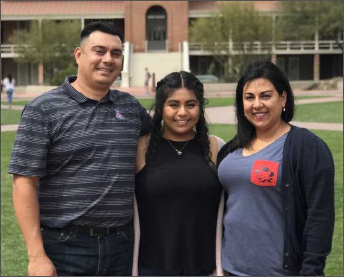 family in front of Old Main