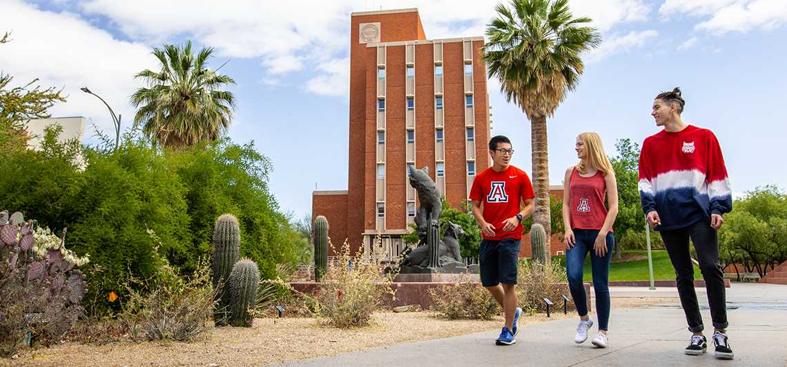 three students walking from class