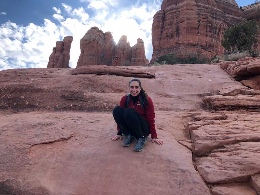 Alice sitting on a red rock in Sedona, Arizona