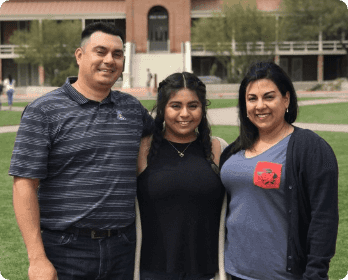 Family in front of old main