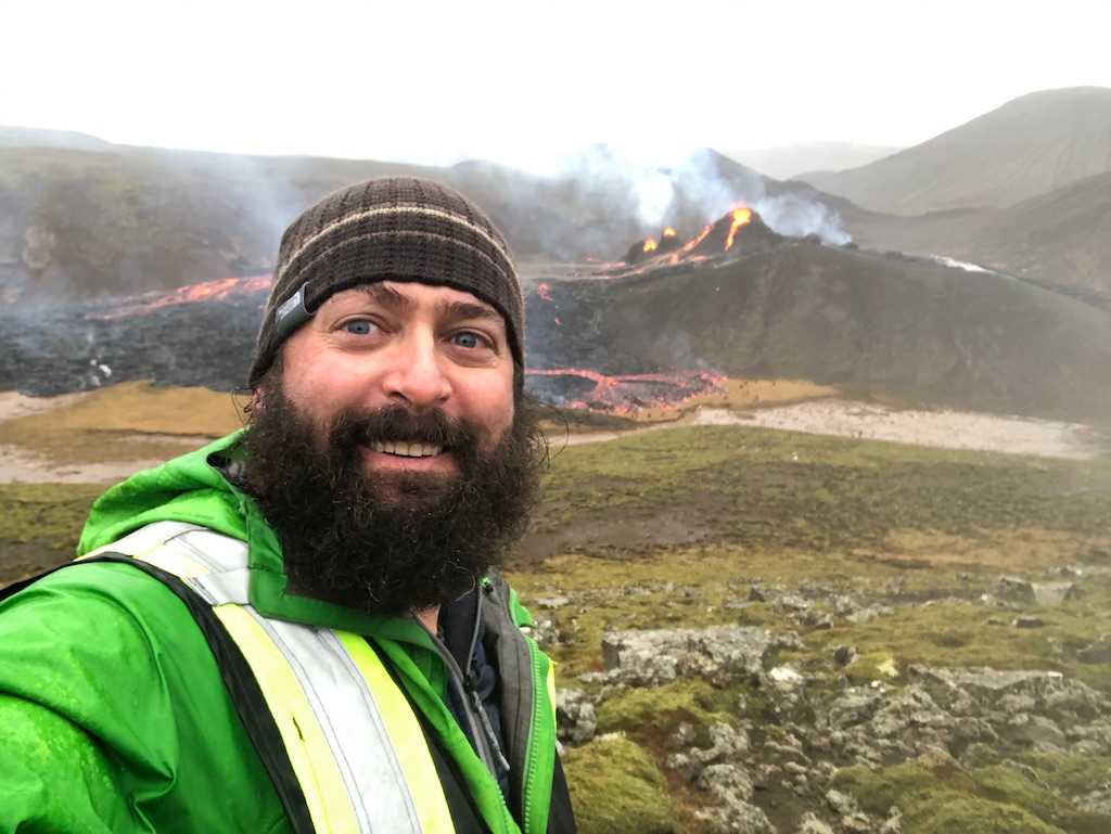 Associate professor Christopher Hamilton with volcano