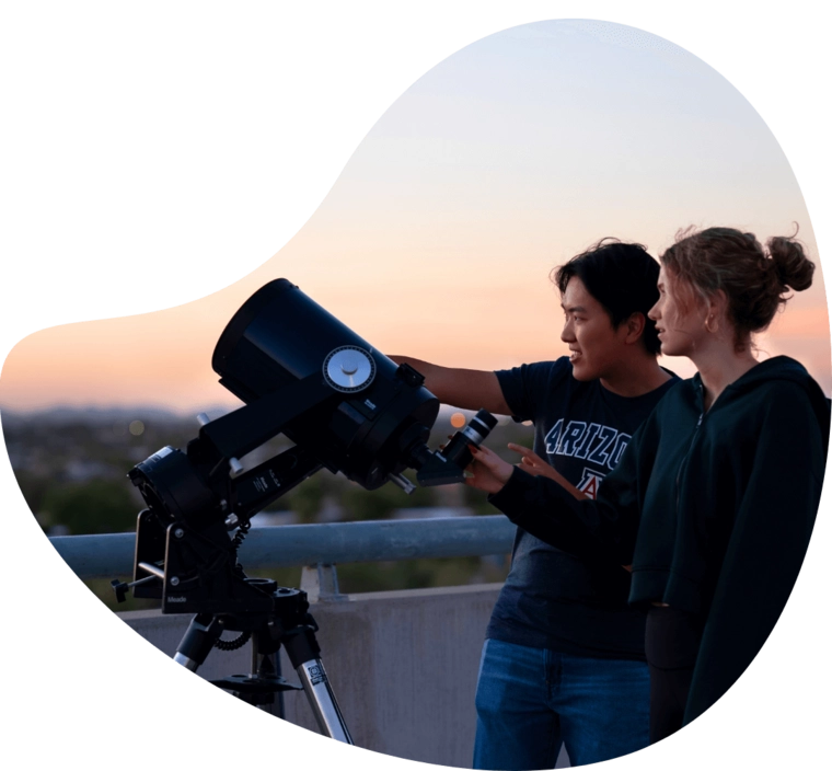 students using a telescope