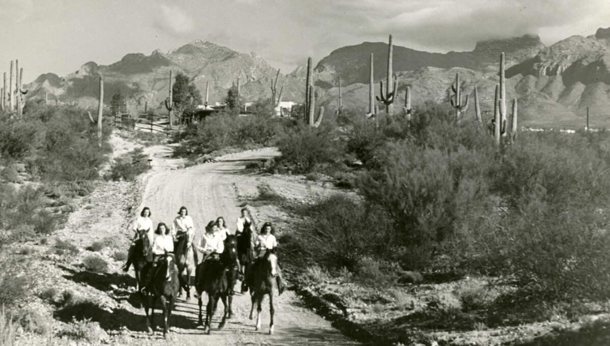 old image of Tucson desert with people riding horses