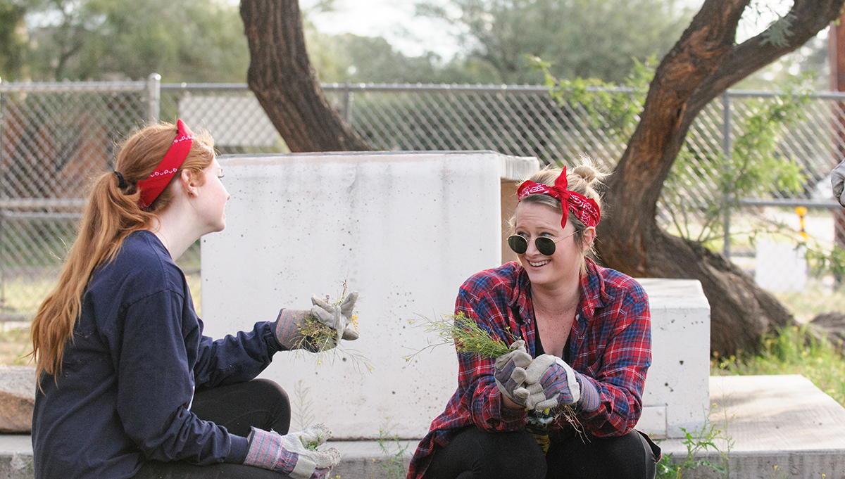 two students volunteering