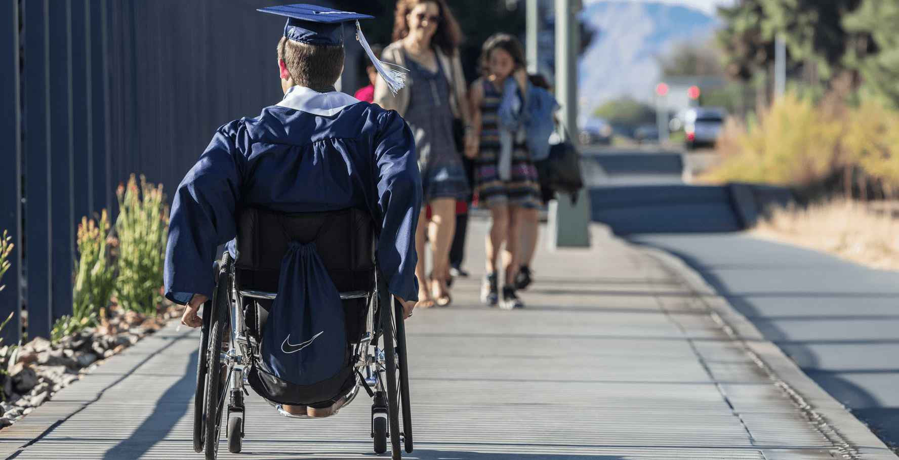 student at graduation in a wheelchair