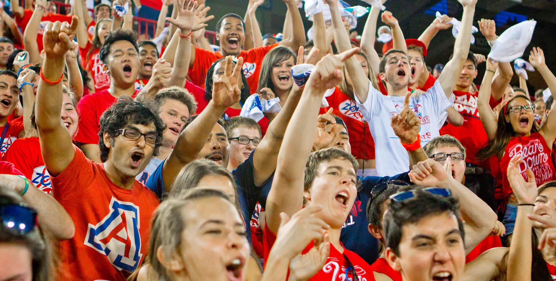 students cheering at a sports event