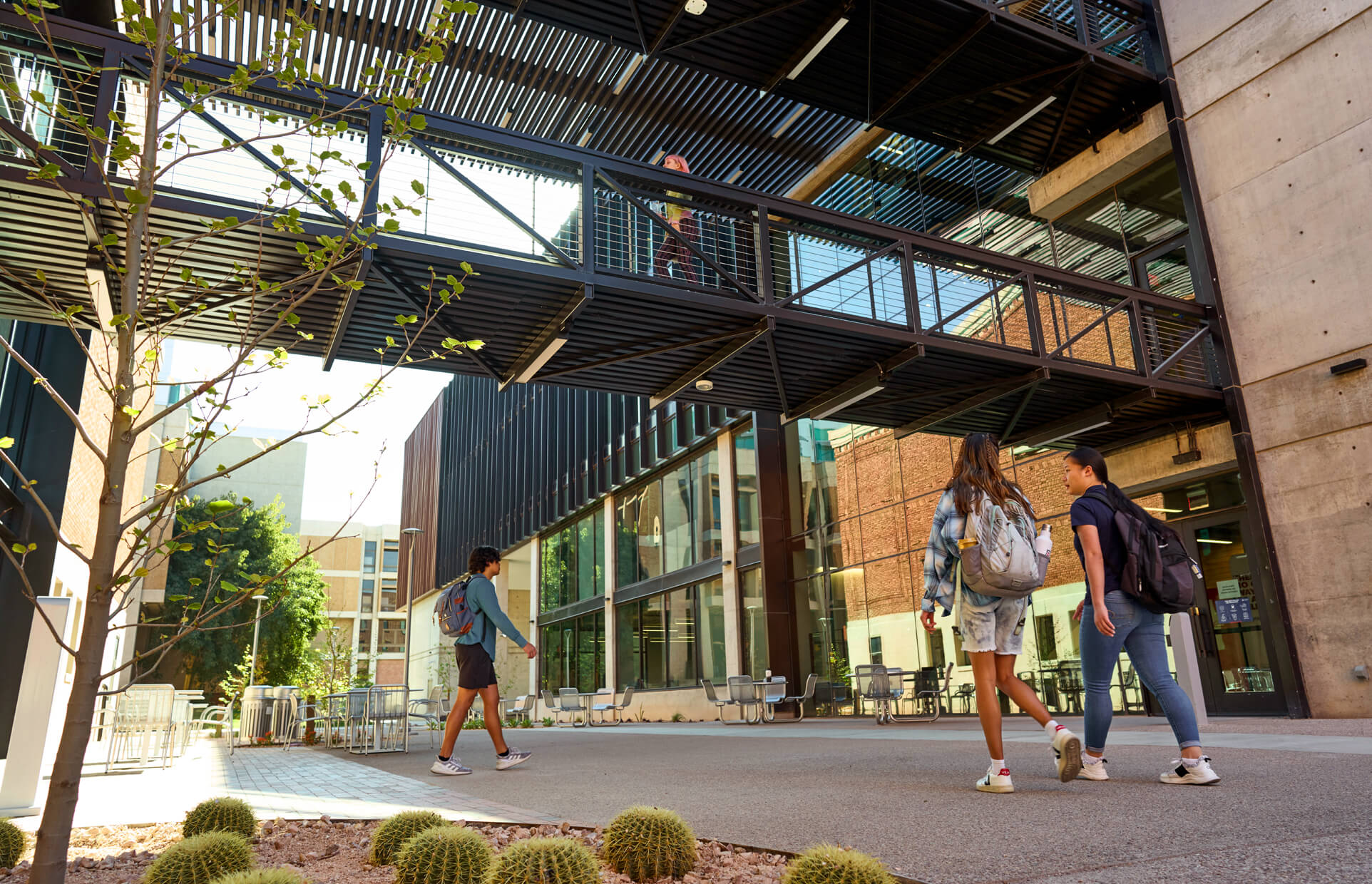 students walking outside on campus