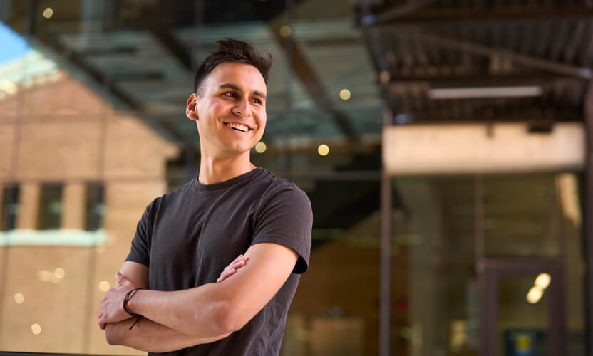 student smiling on campus