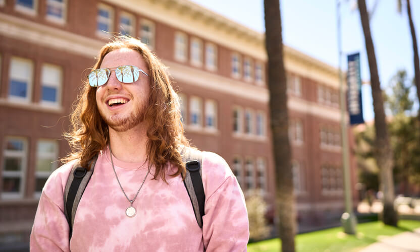 student smiling on campus
