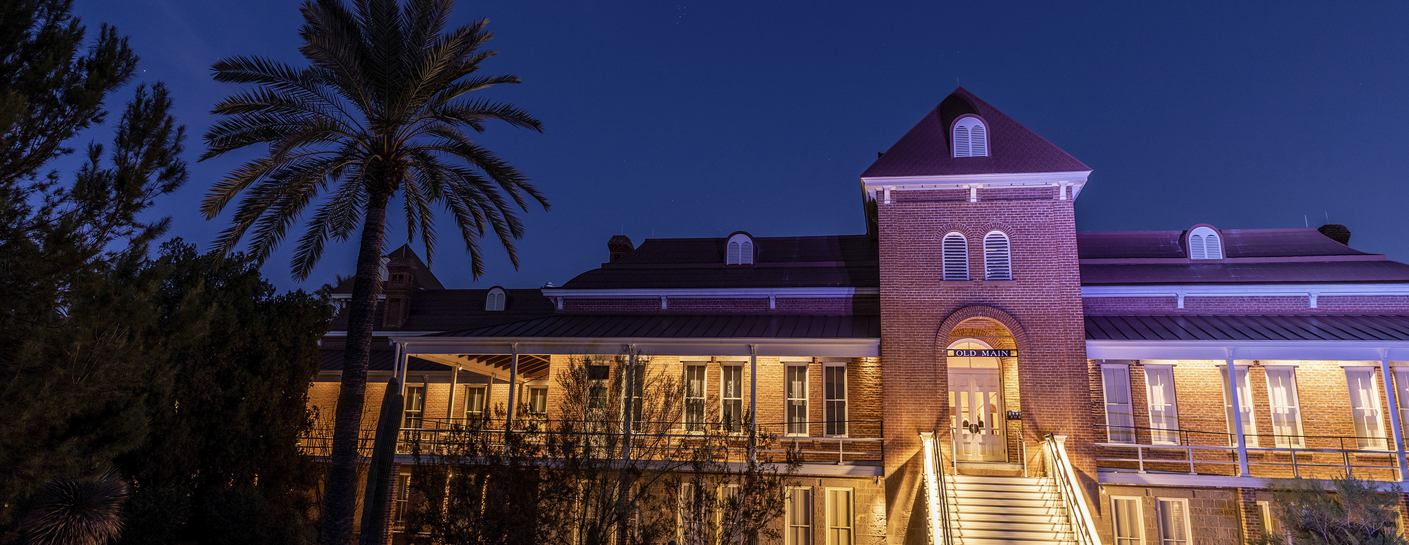 old main building lit up at night
