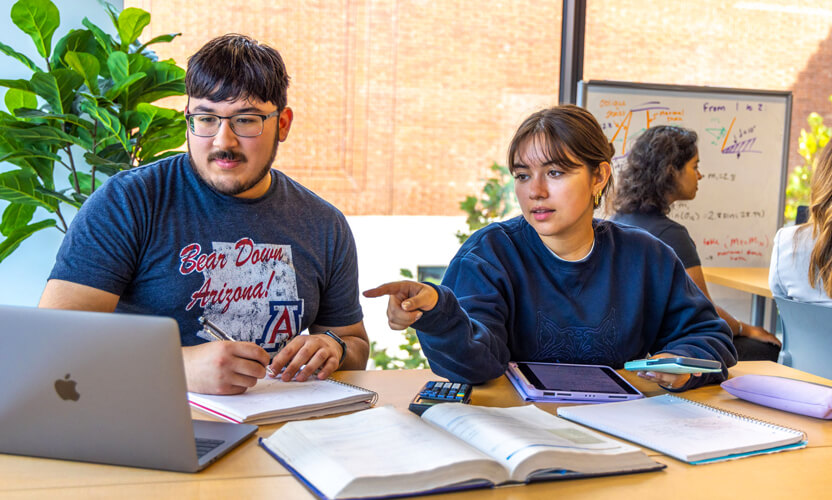 two students working together on homework