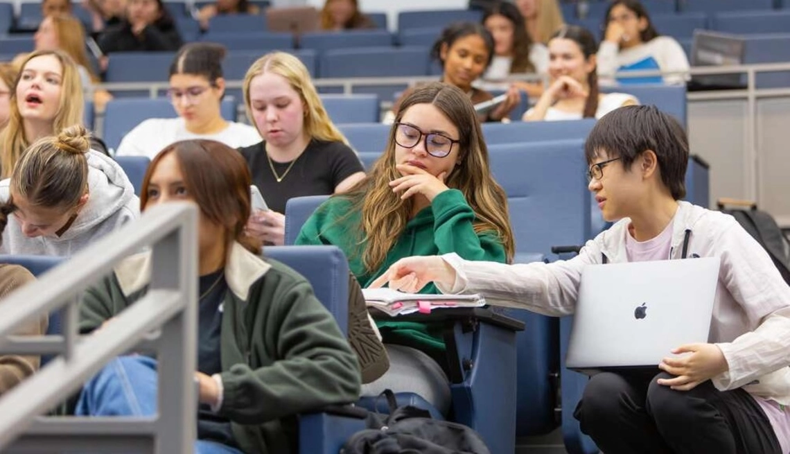 two students working together in a classroom