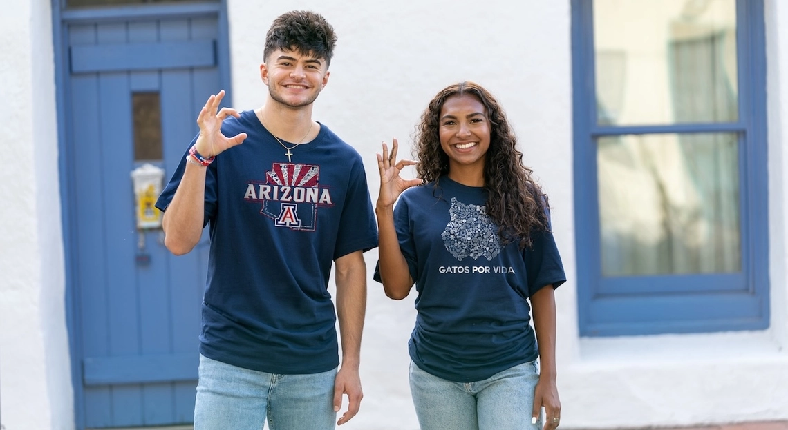 two students wearing hispanic heritage apparel