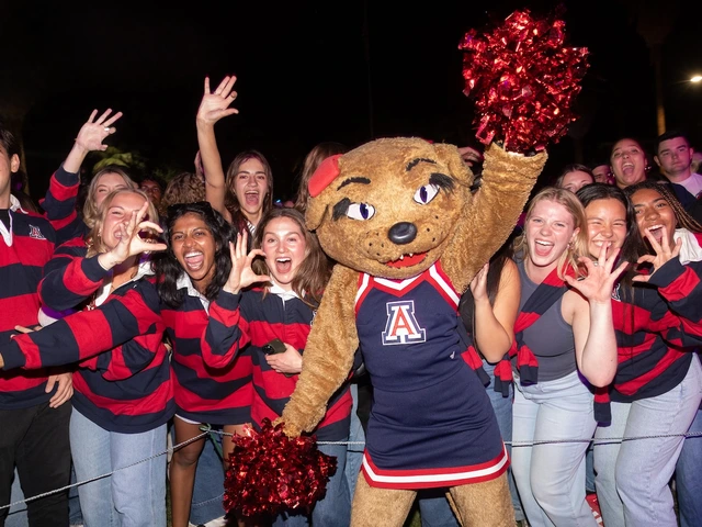 Wilma Wildcat celebrates with several University of Arizona students