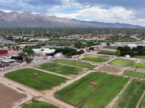 aerial view of the university of arizona campus agricultural center with the santa catalina mountains in the background