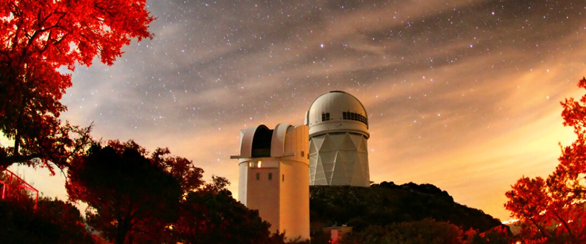 View of sky at dusk with Kitt Peak National Observatory in the middle