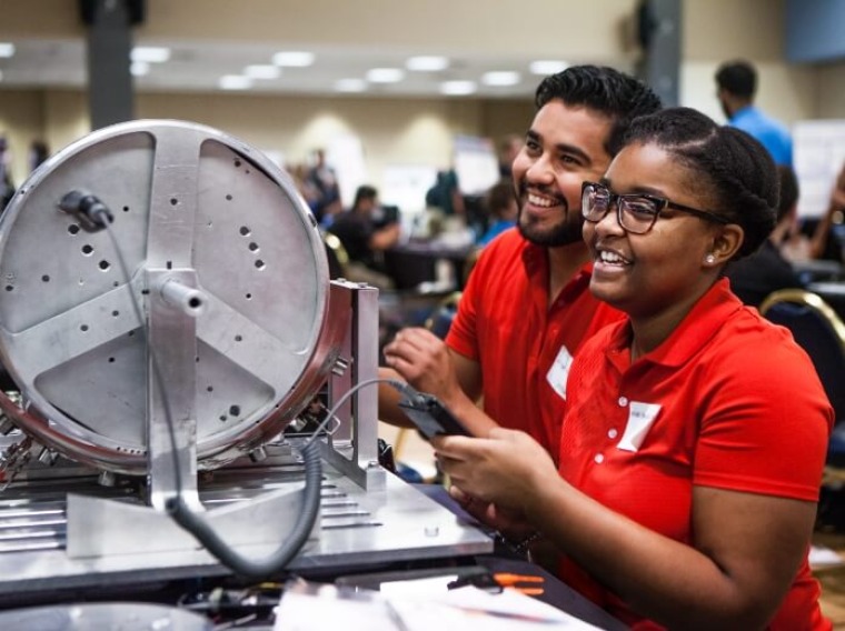 Two robotics students at the University of Arizona