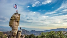 Students raising Arizona flag